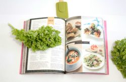 Open cook book with ingredients nearby